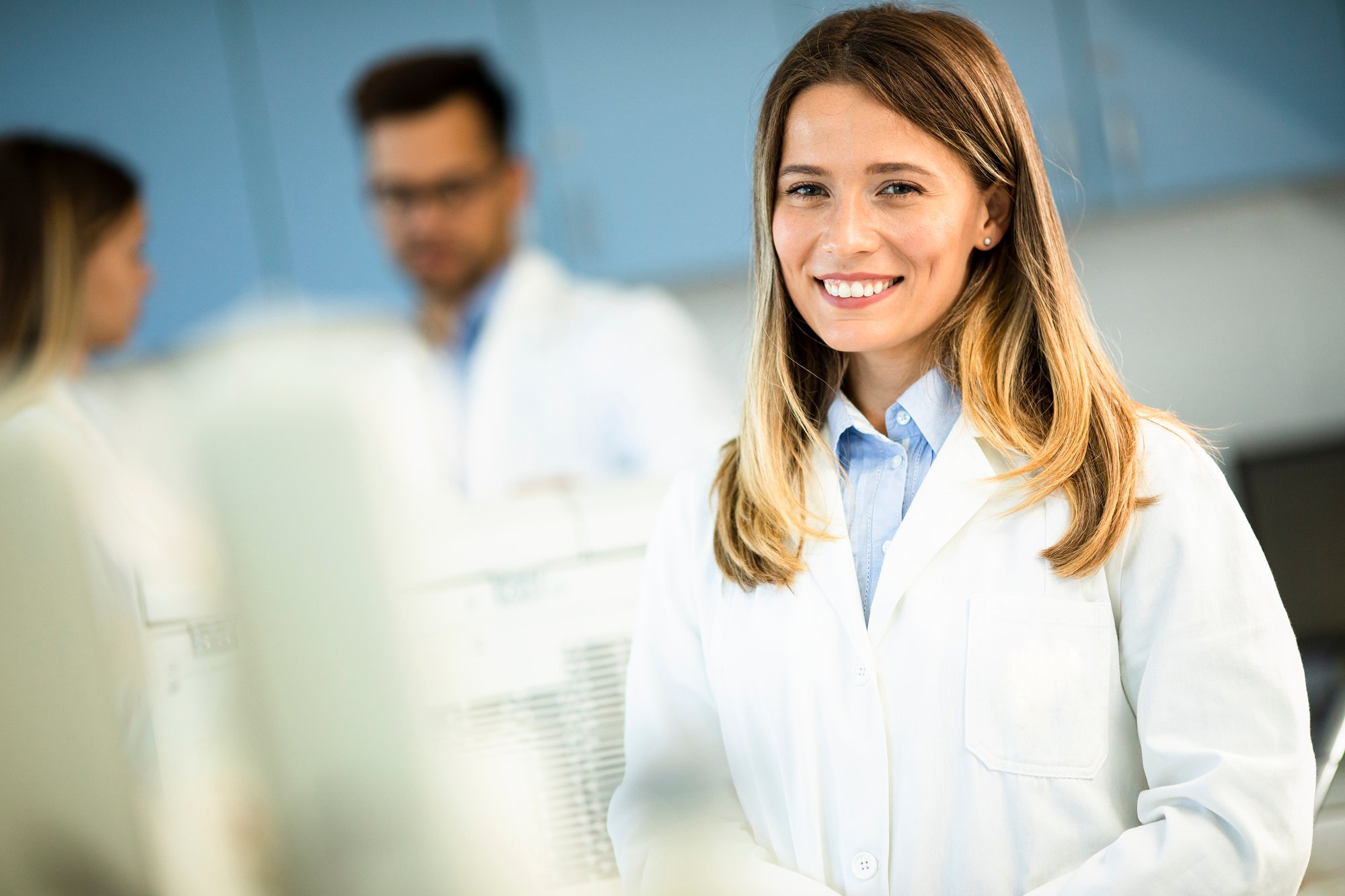 female-scientist-in-white-lab-coat-standing-in-the-2023-11-27-05-21-19-utc